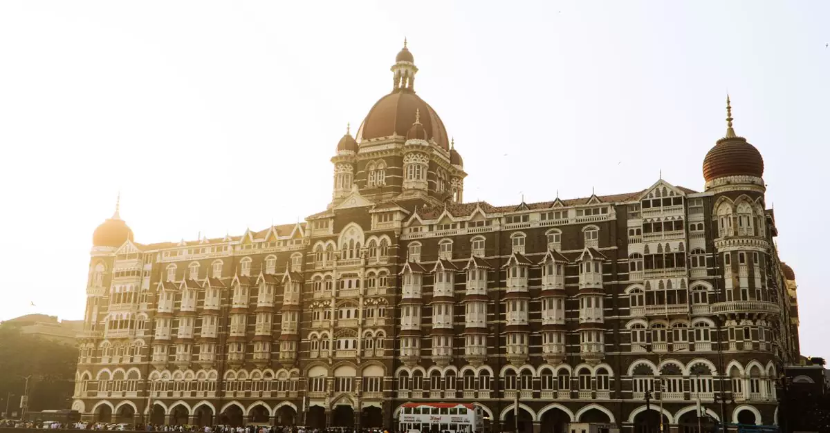 Beautiful view of the iconic Taj Mahal Palace Hotel in Mumbai during a serene sunrise.