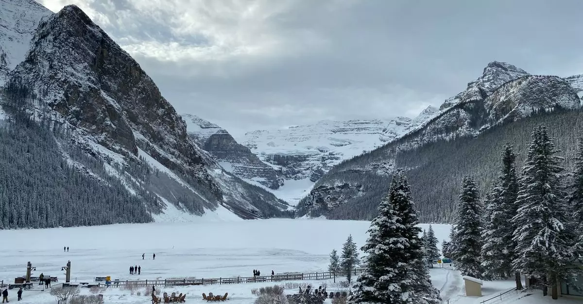 Breathtaking winter landscape of Lake Louise, featuring snowy mountains and a frozen lake.