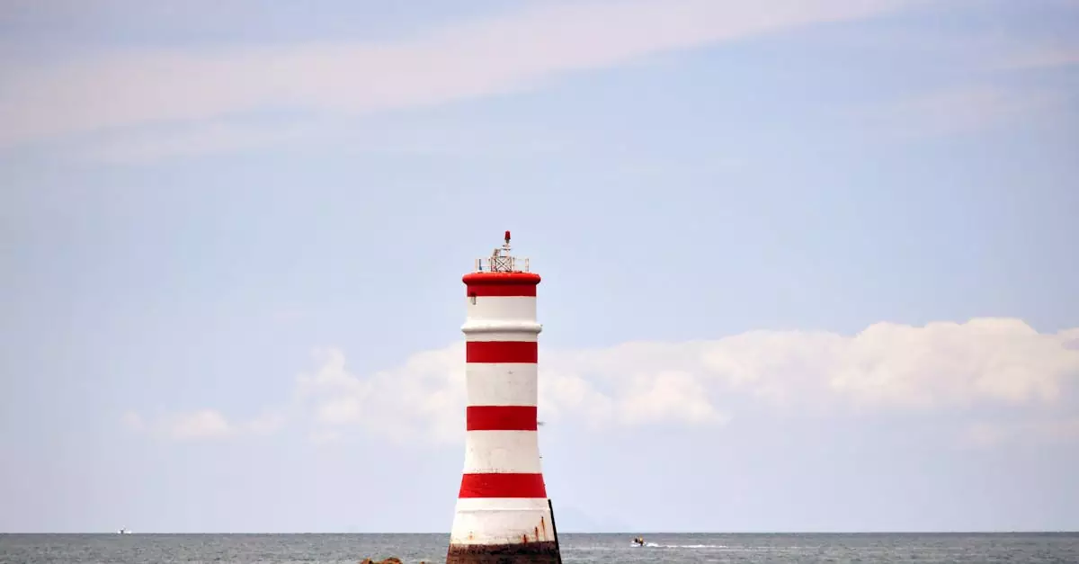 Iconic Rangitoto lighthouse standing tall against the ocean backdrop in Auckland, New Zealand.
