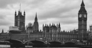 Monochrome view of Big Ben and Westminster Bridge over the Thames in London, UK.