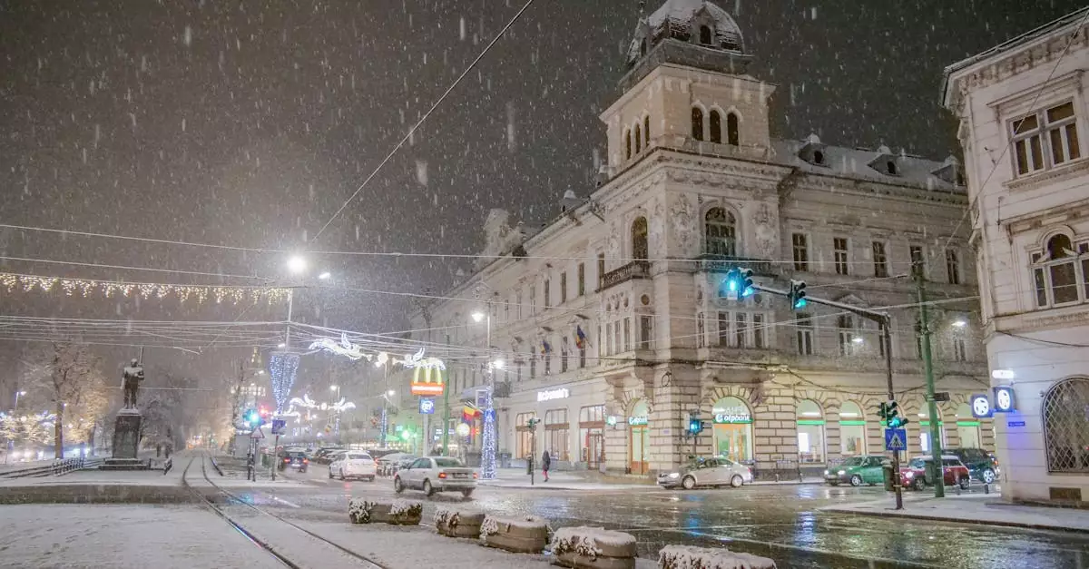 A snowy winter night scene in Arad, Romania, showcasing historic buildings under festive lights.