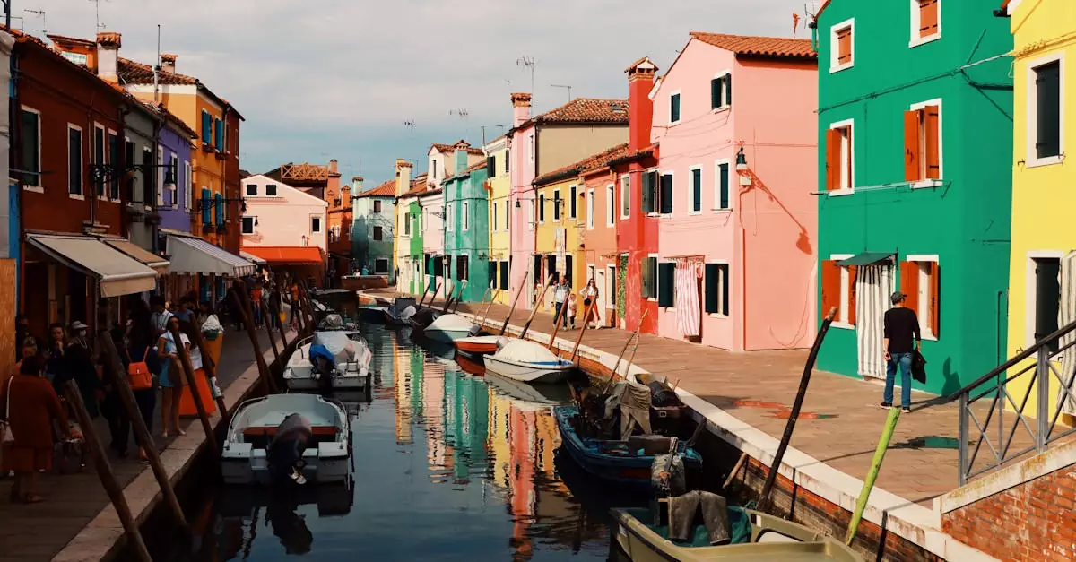 Scenic view of Burano's vibrant canal with colorful houses and boats in Venice, Italy.
