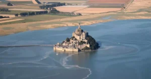 Stunning aerial view of Mont Saint-Michel in Normandie, a famous UNESCO World Heritage site.