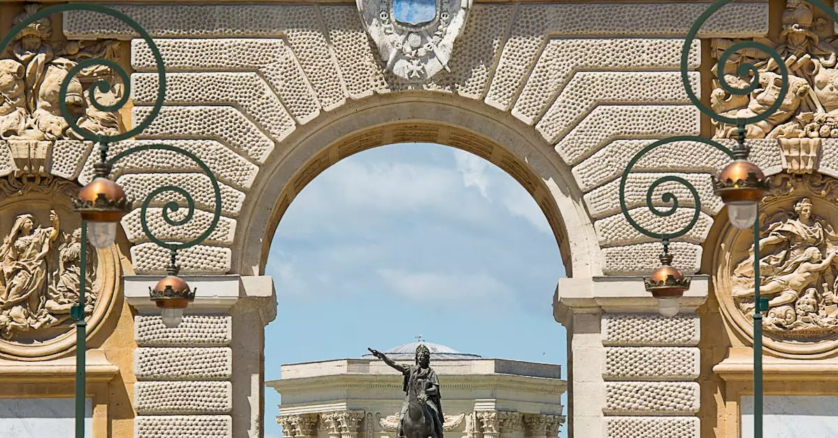 Close-up of Arc de Triomphe in Montpellier with intricate carvings and a statue visible through the arch.