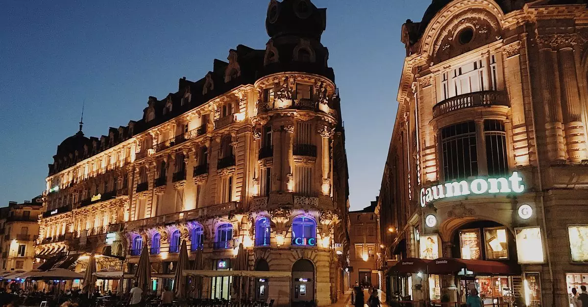 Stunning view of illuminated buildings in Montpellier's urban landscape at dusk.
