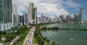 Stunning aerial shot of Panama City's skyline with coastal views and busy streets.