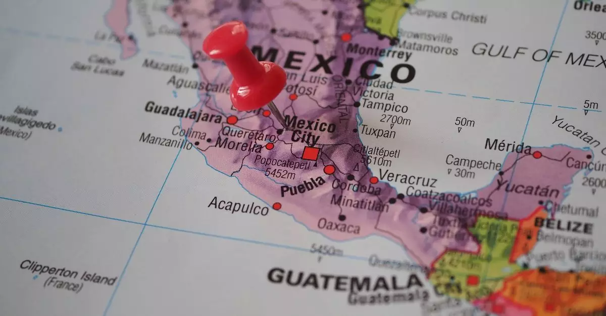 Detailed close-up of a map featuring Mexico with a red pushpin highlighting a location.