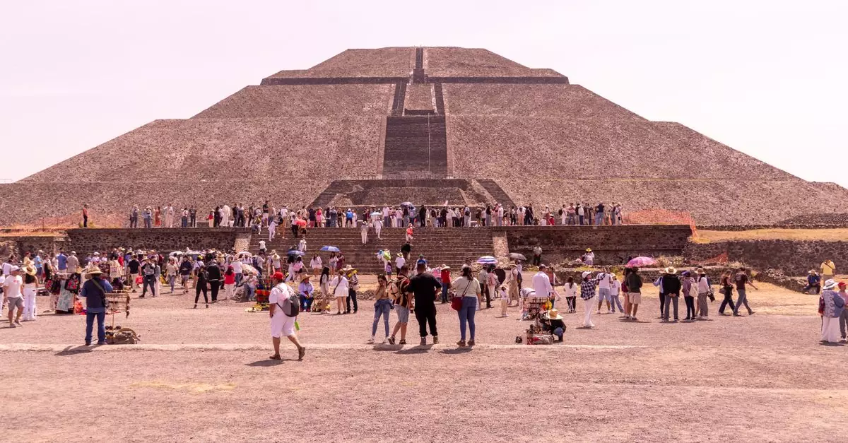 Visitors exploring the iconic Pyramid of the Sun at Teotihuacán, a historic landmark in Mexico.