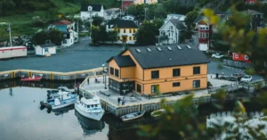 Charming aerial view of Quidi Vidi village and harbor with boats and colorful houses in St. John's, Newfoundland.