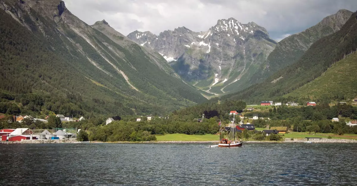 Dramatic Norwegian fjord landscape with a traditional boat and lush mountains.
