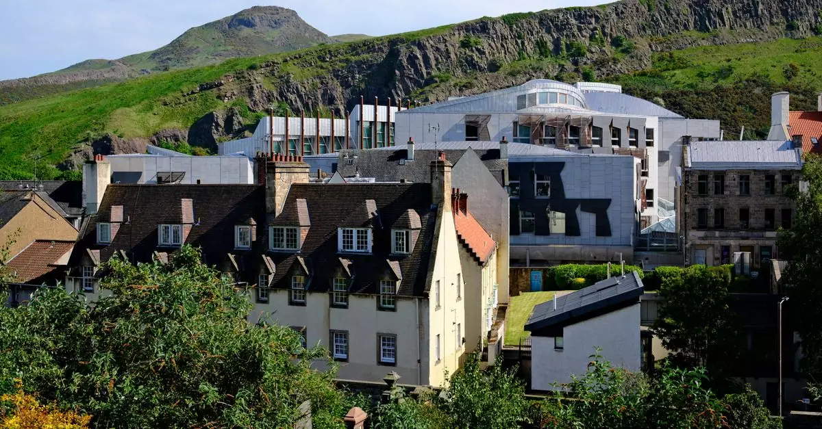 Scenic view of Edinburgh with Arthur's Seat in the background, showcasing historic and modern architecture.