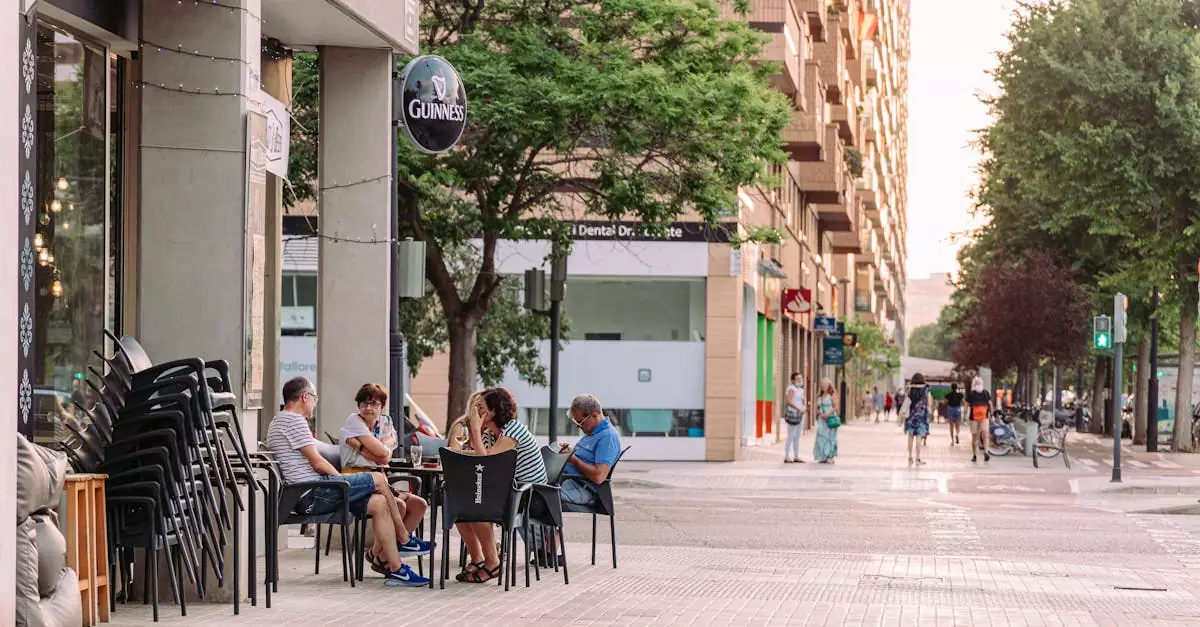 People enjoying drinks at an outdoor cafe in Valencia, Spain. Urban lifestyle captured.