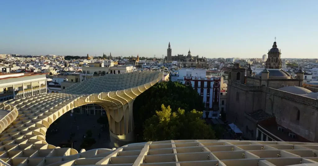 Seville Tapas Restaurants: Your Guide to Authentic Bites 6 Panoramic view of Metropol Parasol and Seville skyline at sunset with historical landmarks.