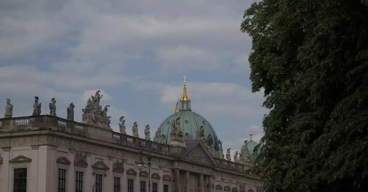 Historic Baroque facade of Berlin's Zeughaus against a cloudy sky, showcasing architectural beauty.