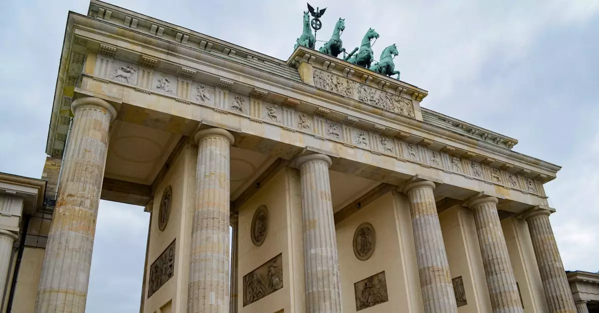 A striking low angle of the Brandenburg Gate, an iconic neoclassical monument in Berlin, Germany.