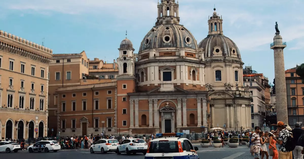 View of the churches of Santa Maria di Loreto and Trajan's Column in bustling Rome, Italy.