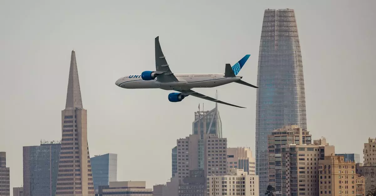 A United Airlines jet soaring over the iconic San Francisco skyline.