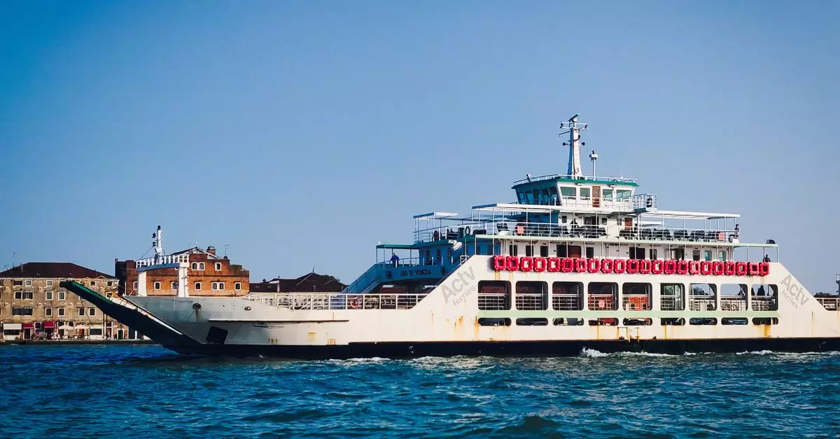 Ferry crossing the Venetian waters with a clear blue sky, showcasing transportation in Venice.