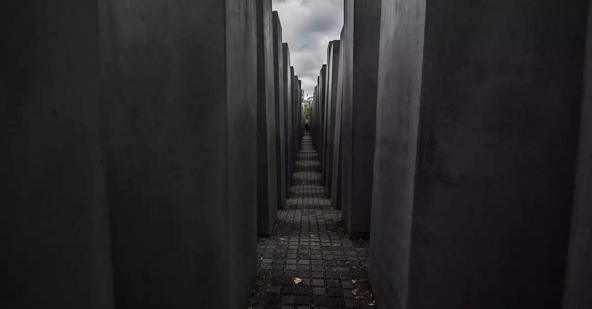 Dramatic view of the Holocaust Memorial in Berlin under a cloudy sky.